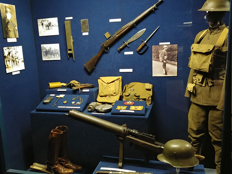 Museum artifacts in glass enclosure at the 2nd Infantry Division Museum.